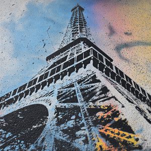 Résultat artistique utilisant un pochoir de la Tour Eiffel avec fond coloré